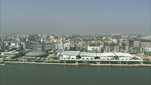 AERIAL WS Cityscape with park das Nacoes /葡萄牙里斯本视频素材