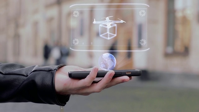 男性双手显示在智能手机HUD全息图交付无人机视频素材