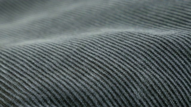 Slow pan on indigo color velvet fabric tufted parallel cord close-up 4K 2160p 30fps超高清镜头- Panning on dark blue cotton corduroy twisted fibers 3840X2160超高清视频视频素材