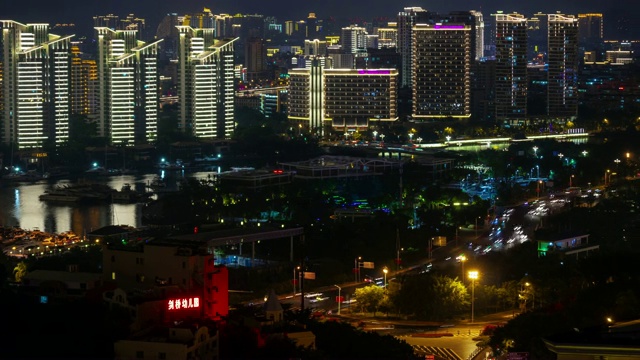 夜晚时间照亮三亚交通街道公寓综合体屋顶全景4k海南岛中国视频素材