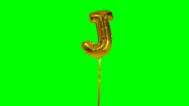 字母J从字母氦气金色气球漂浮在绿色屏幕上视频下载