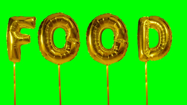 单词食物从氦气金色气球字母漂浮在绿色屏幕上视频下载