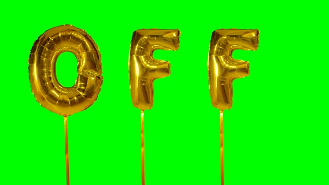 绿色屏幕上漂浮着金色氦气气球上的字母视频下载
