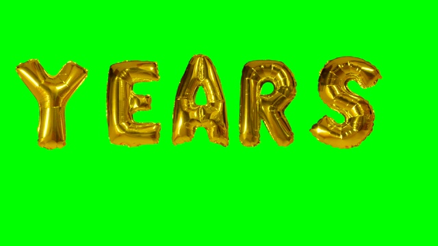 从氦金气球上漂浮在绿色屏幕上的字母单词年视频下载