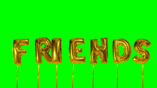 单词朋友从氦气金色气球字母漂浮在绿色屏幕上视频下载