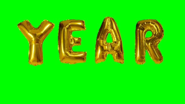 单词年从氦气金气球字母漂浮在绿色屏幕上视频下载