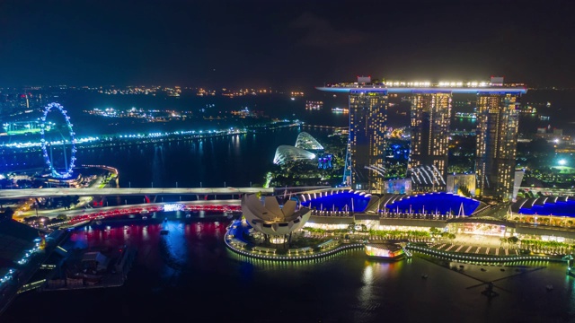 夜光飞行在新加坡滨海城市湾空中全景4k时间推移视频素材