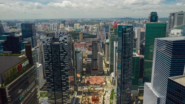 阳光明媚的一天新加坡城市景观滨海湾市中心空中全景4k时间推移视频素材