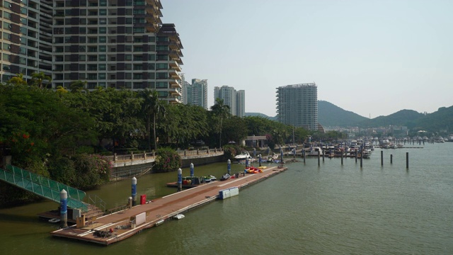 阳光明媚的一天时间三亚市水上交通湾码头大桥全景4k中国海南视频素材