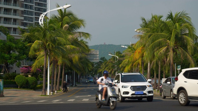 三亚城市中心日落晴天交通街道十字路口全景4k海南中国视频素材