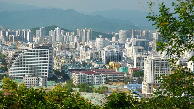 阳光明媚的一天三亚城市景观公园顶部全景4k海南中国视频素材