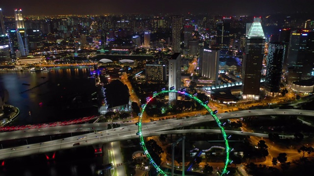 夜光飞行在新加坡城市市中心飞行顶部空中全景4k视频素材