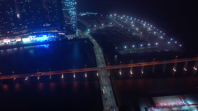 夜澳门河交通大桥路巴士站湾航拍全景4k中国视频素材