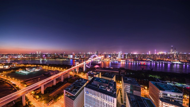 高处俯瞰上海黄浦江卢浦大桥黄昏到夜景的城市景观视频素材