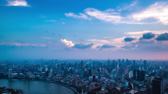 高空俯瞰上海城市城市天际线日落到夜晚的过渡视频素材