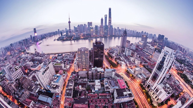 高空俯瞰上海城市全景及城市街道夜景与白天的过渡视频素材