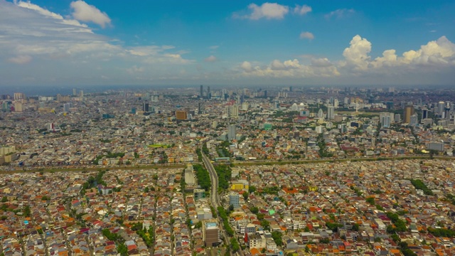 阳光明媚的一天雅加达城市景观航空延时全景4k印尼视频素材