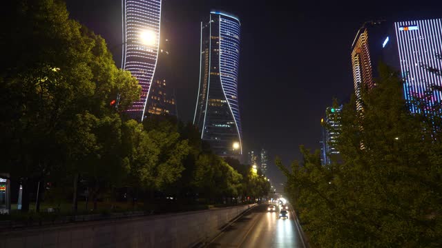 夜景时间照亮杭州市区现代建筑、交通街道、隧道全景4k中国视频素材