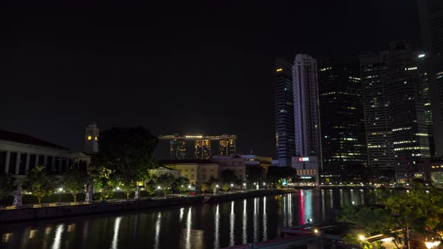 从晚上到早上新加坡市区著名的船码头酒店的时间推移全景4k视频素材