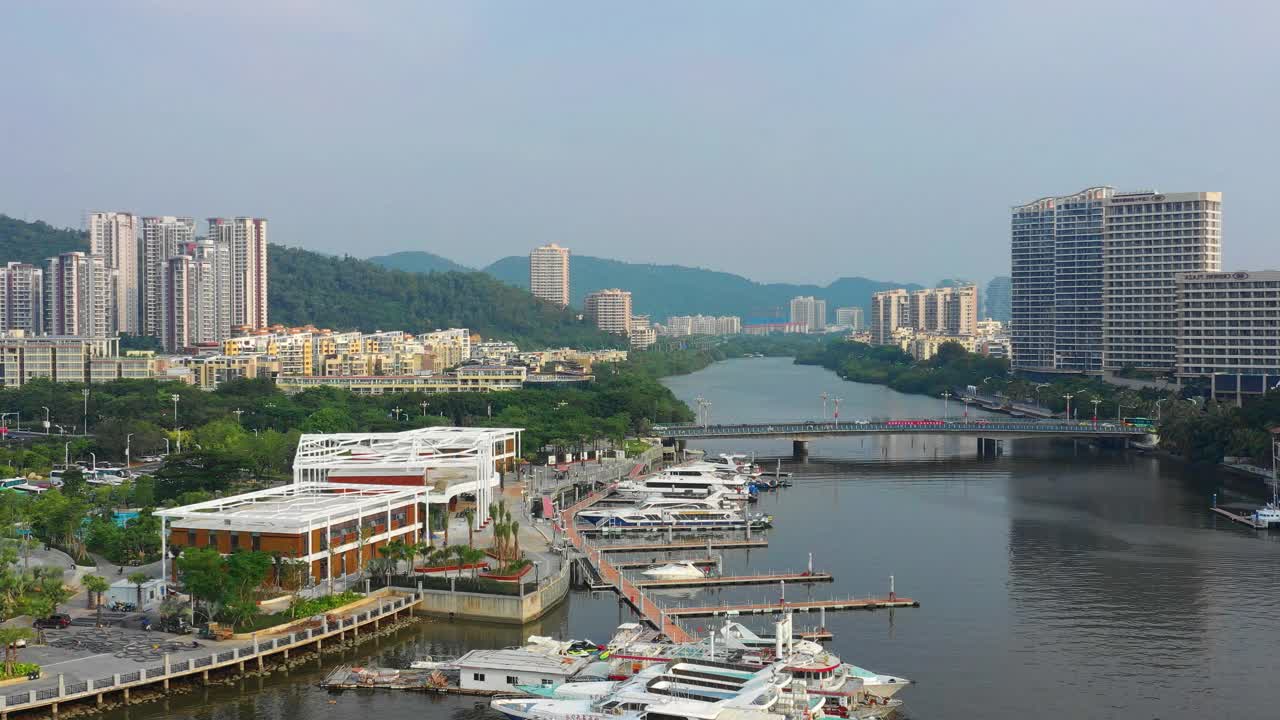 阳光明媚的一天时间海南岛三亚船坞航拍河滨全景4k中国视频素材