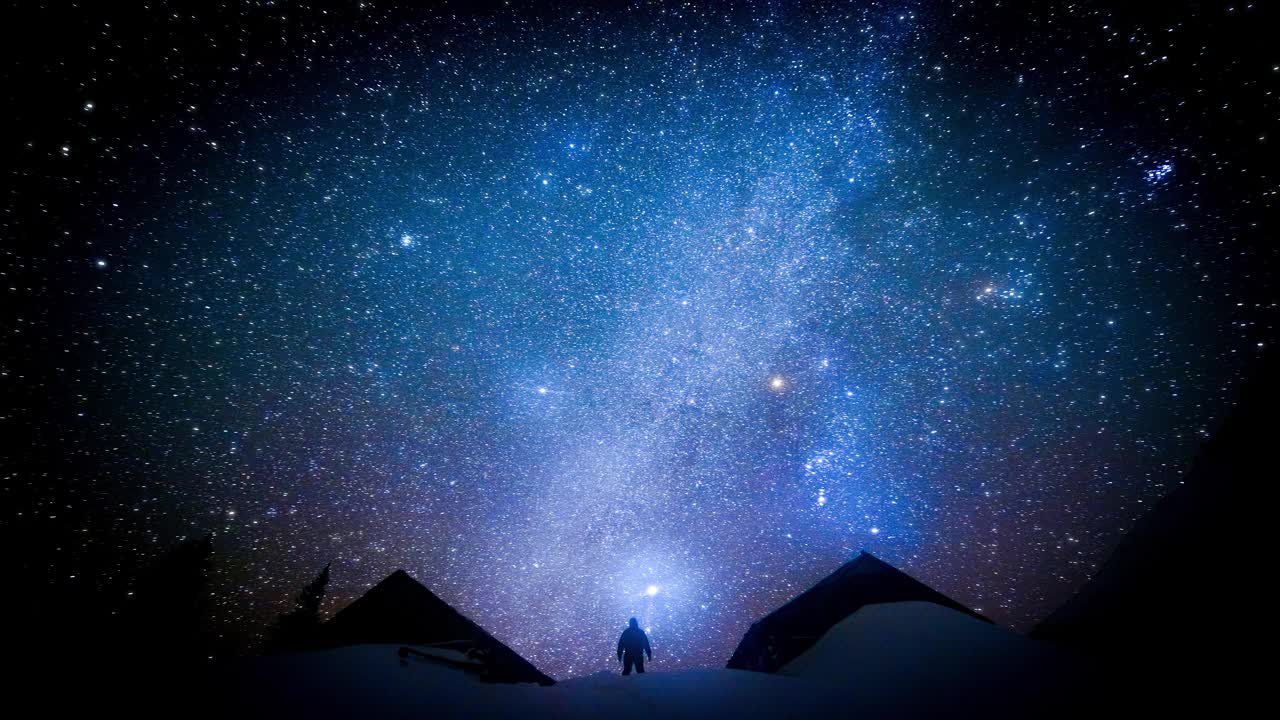 闪烁的星空背景上的人类。Cinemagraph。视频素材