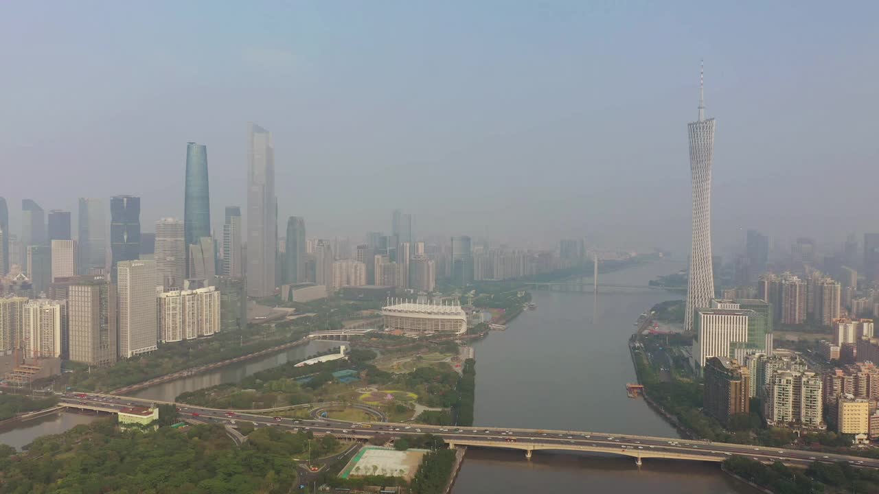 阳光明媚的傍晚广州市区交通大桥著名铁塔河边航拍全景4k中国视频素材