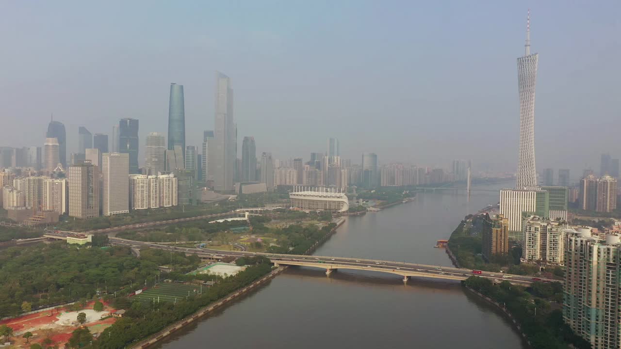 阳光明媚的傍晚广州市区交通大桥著名铁塔河边航拍全景4k中国视频素材