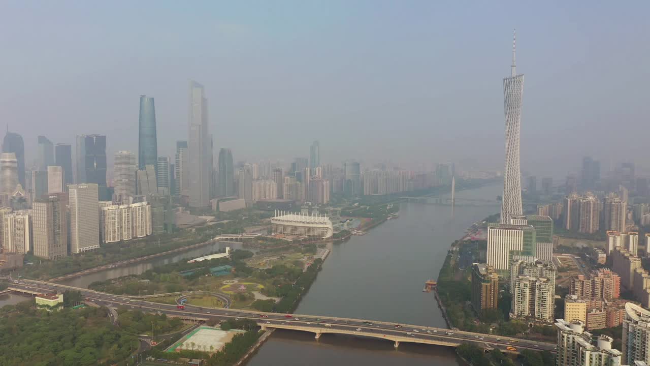 阳光明媚的傍晚广州市区交通大桥著名铁塔河边航拍全景4k中国视频素材