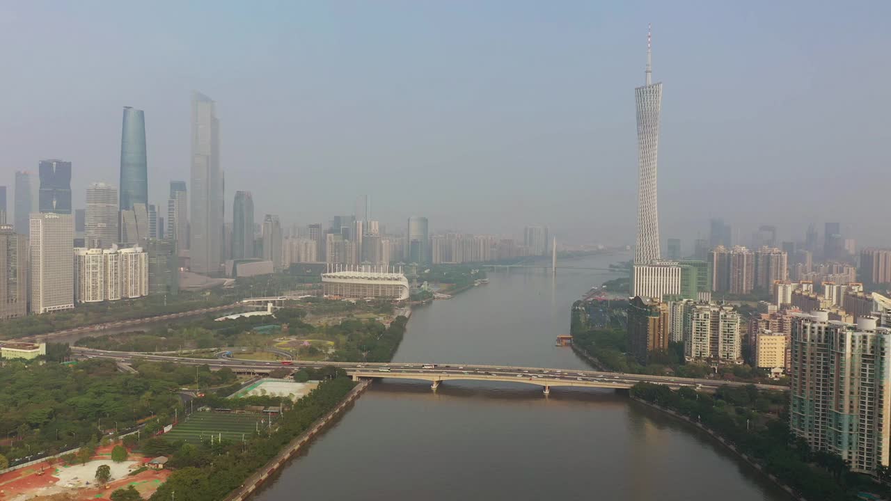 阳光明媚的傍晚广州市区交通大桥著名铁塔河边航拍全景4k中国视频素材