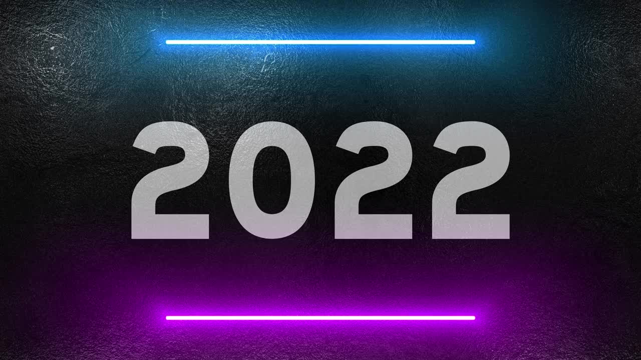 2022年的数字即将到来的新年被霓虹灯照亮视频素材