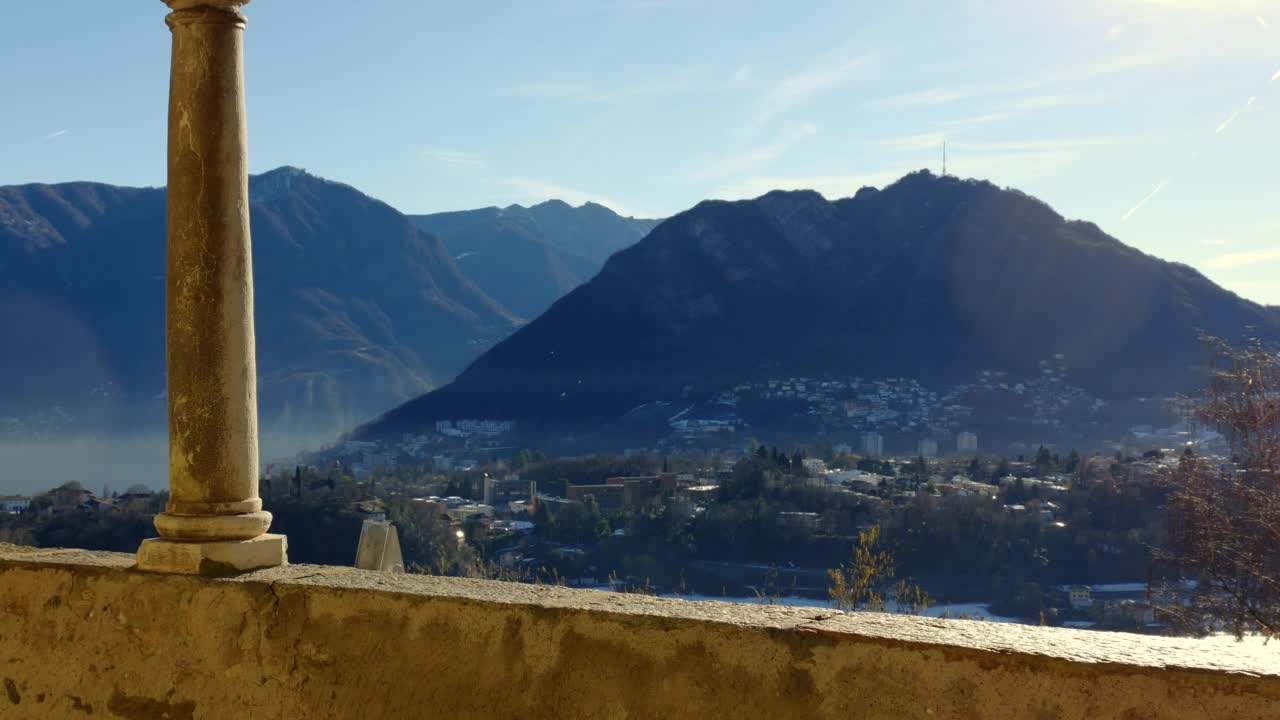 阳光明媚的卢加诺山景和城市景观视频素材