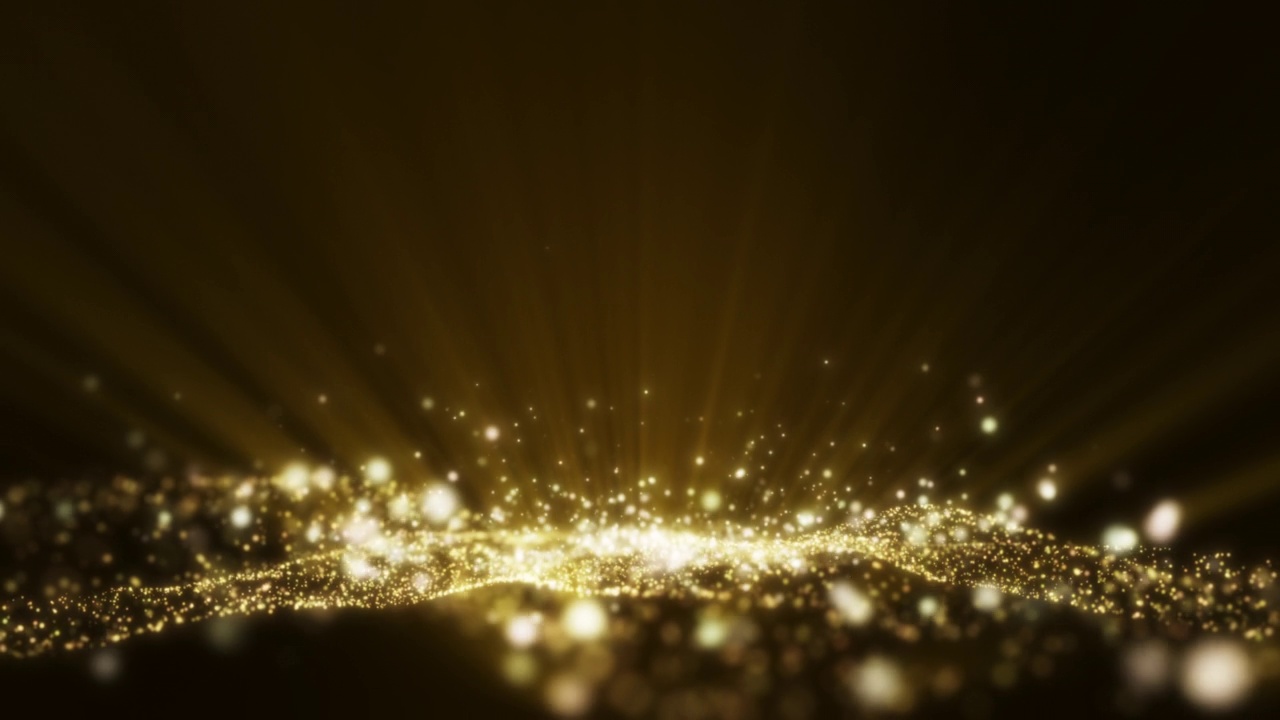 黄色黄金光射线照耀辉光粒子抽象背景。视频素材