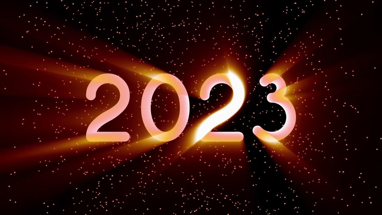 文字2023动画和火花隔离在黑色背景上，2023新年，设计模板快乐2023新年概念假期动画卡视频素材