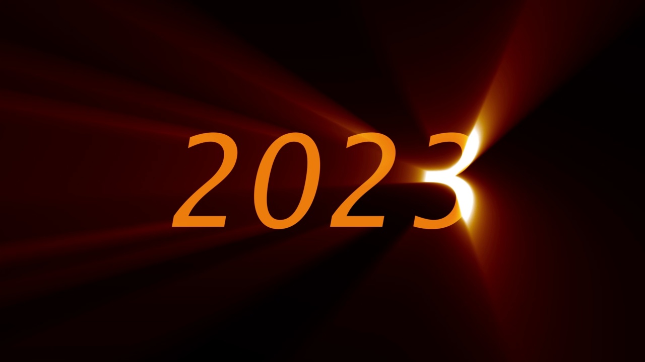 文字2023动画和火花隔离在黑色背景上，2023新年，设计模板快乐2023新年概念假期动画卡视频下载