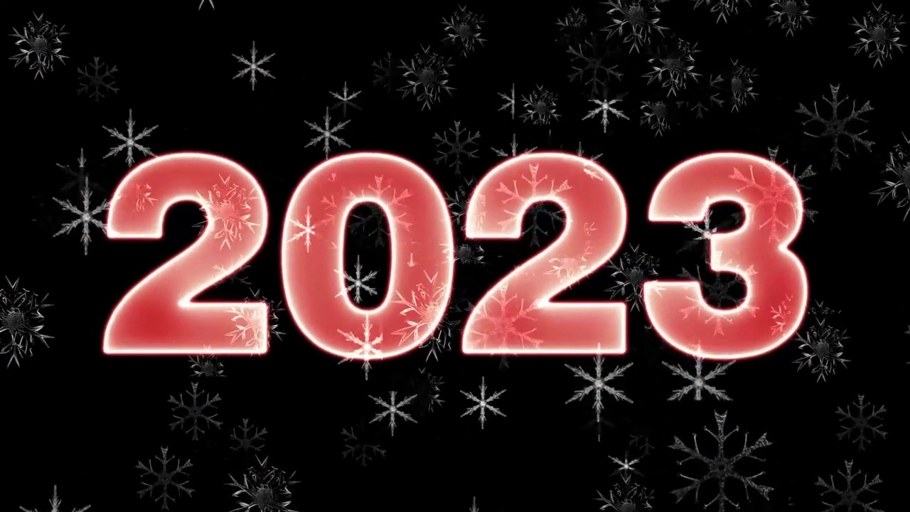 文字2023动画和火花隔离在黑色背景上，2023新年，设计模板快乐2023新年概念假期动画卡视频下载