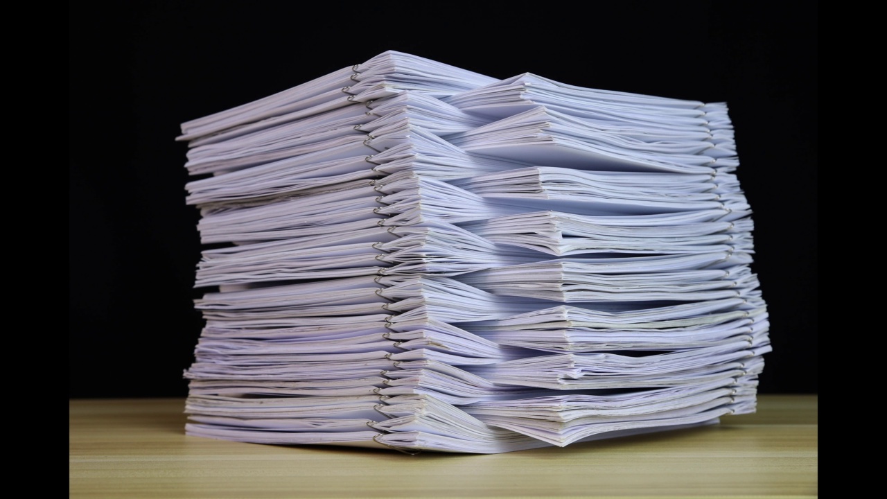 stack of paper documents with clip on a wooden table. Corporate business financial data management concept. Organize Documents – 4K Stop Motion, Stack Files Overload视频素材