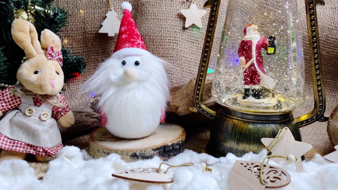 Christmas rabbit, 2023 animal, New Year tree and magical lantern with Santa Claus on wooden and burlap backgroundб folk style.  Selective focus.视频素材