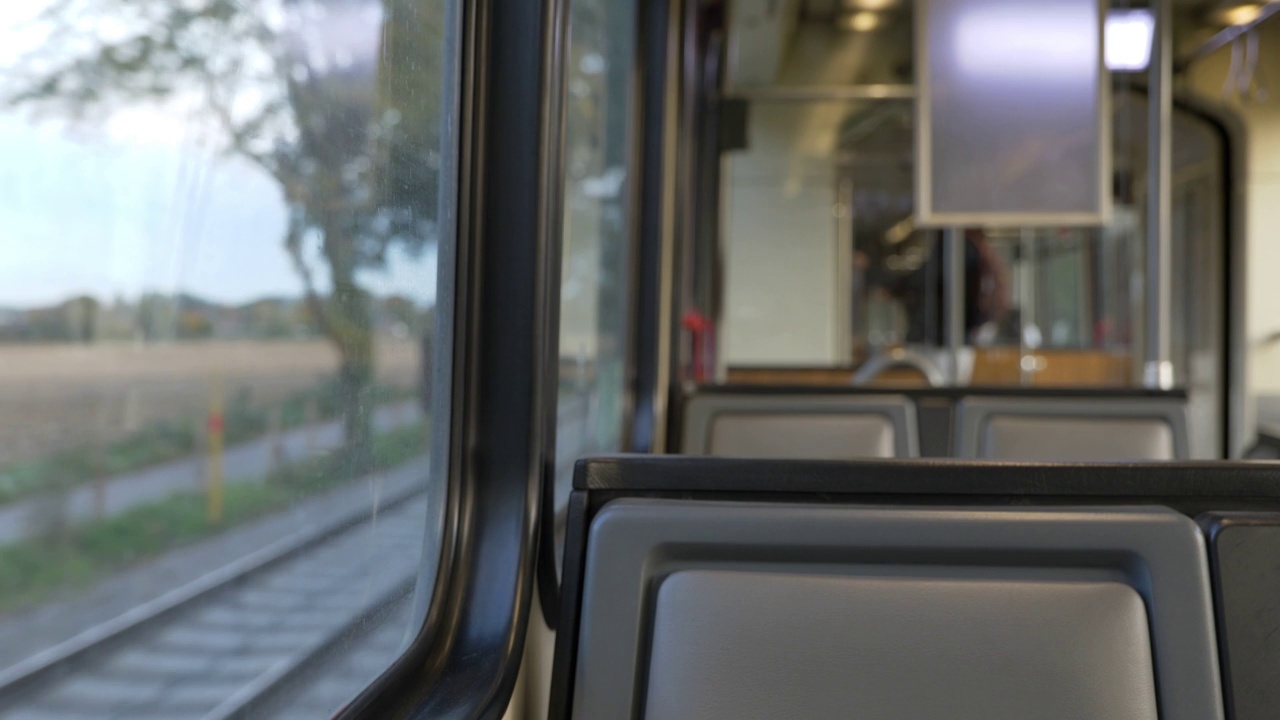 Interior view at train's empty window seat window move through countryside in Düsseldorf, Germany视频素材