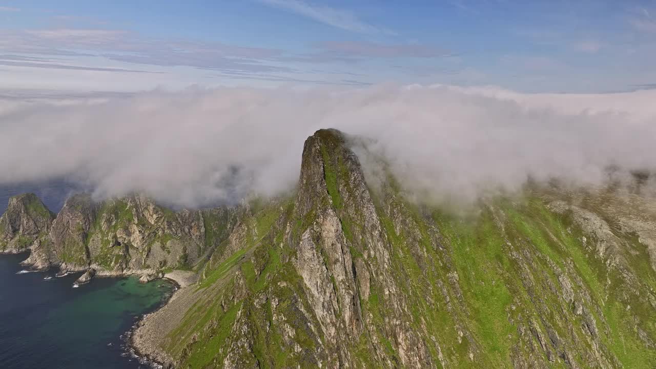 Stave Norway Aerial v17 cinematic drone fly towards måtind viewpoint into the wilderness, capturing coastal mountainscape covered in thick layer of dramatic fog - Shot with Mavic 3 Cine - June 2022视频素材