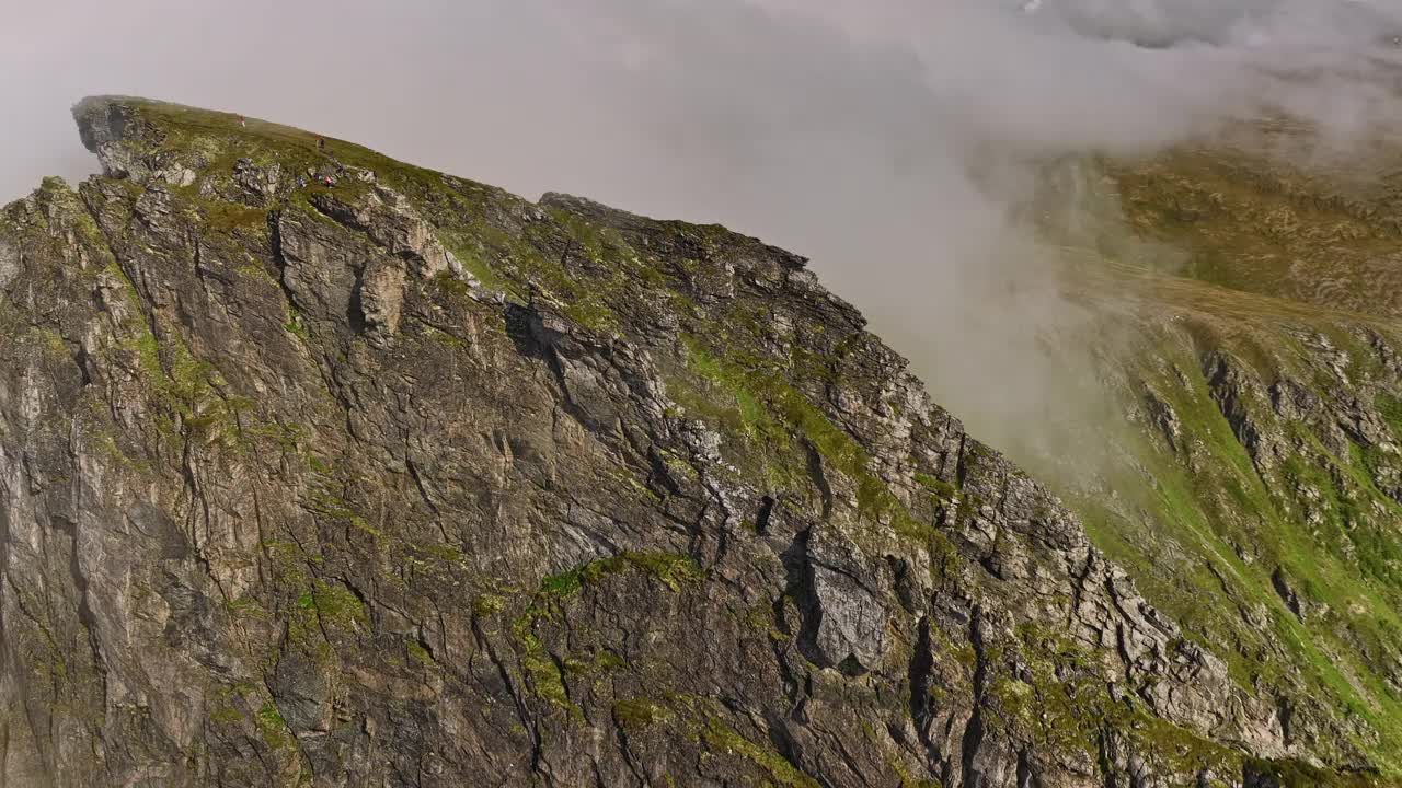 Stave Norway Aerial v20 birds eye view drone fly around craggy måtind mountain viewpoint capturing rocky details and coastal seascape surrounded by thick fog - Shot with Mavic 3 Cine - June 2022视频素材