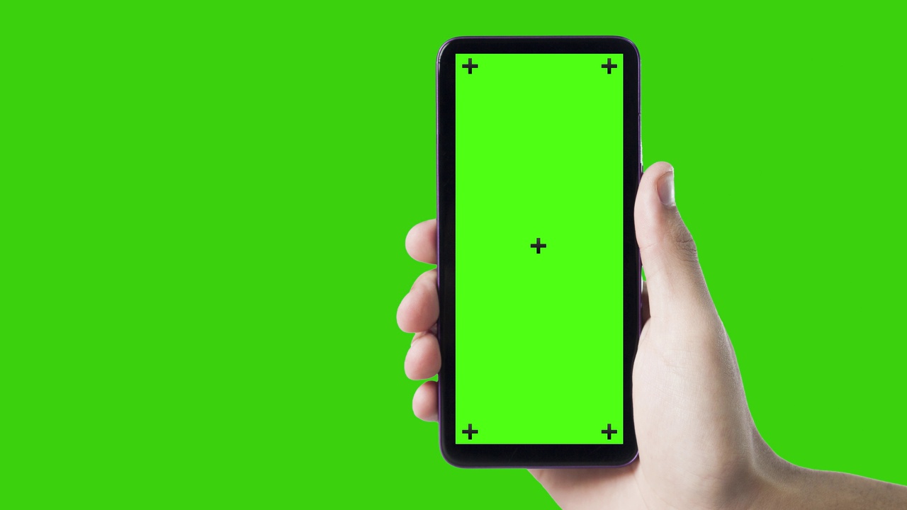 手持智能手机，绿色屏幕。视频下载