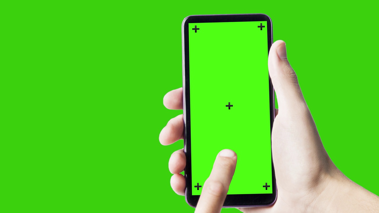 手持智能手机，绿色屏幕。视频下载
