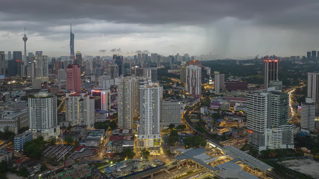 黄昏时分照明雨天吉隆坡市区城市景观交通道路航拍全景4k延时马来西亚视频素材