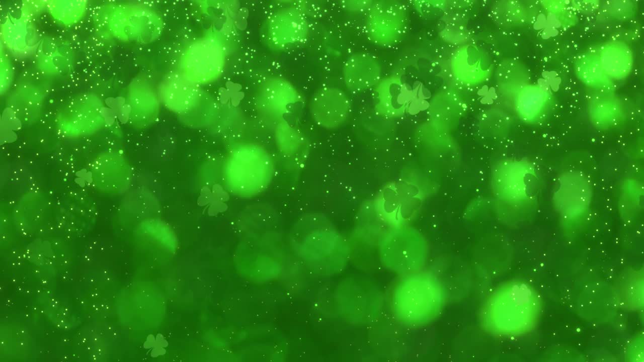 抽象运动绿色闪亮模糊四叶三叶草圣帕特里克节与闪闪发光的尘埃背景无缝循环动画视频下载