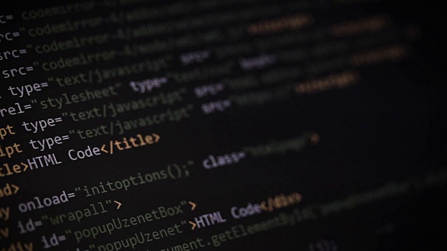 HTML, CSS, JavaScript和PHP彩色代码滚动在黑暗的背景视频素材