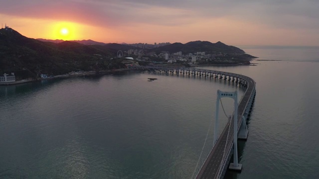 航拍大连星海湾广场跨海大桥日出朝霞视频素材