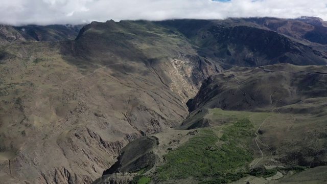 中国西藏山南市洛扎县藏式碉楼山谷自然风光视频素材