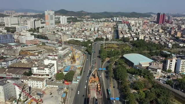 广东省深圳市龙岗区双龙地铁站和龙岗大道航拍视频素材