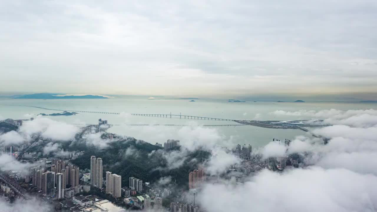 航拍珠海拱北口岸与住宅区云海视频素材