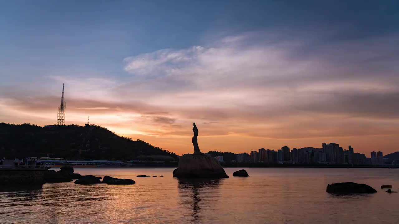 珠海渔女城市风光火烧云日转夜延时视频素材